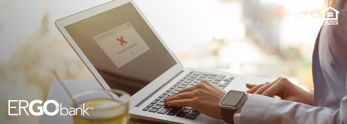 Person's laptop with red denial message on it