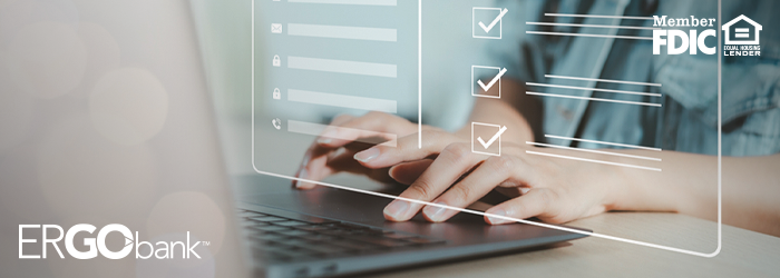 Person typing on a laptop with a screen hovering above to show they are adding contact information for a person