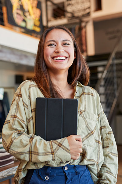 smiling woman with tablet